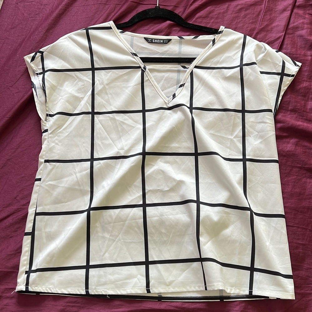 Brand is SHEIN. White blouse with black stripes. Size is an XS. Like new.